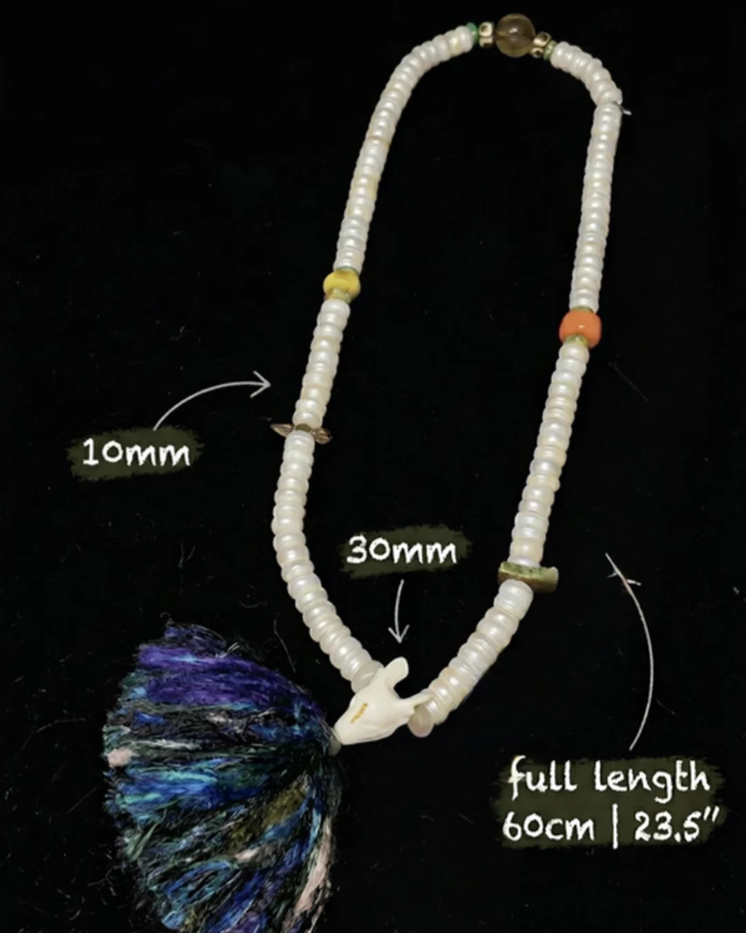 108-pearl mala necklace with colorful tassel and accent beads, labeled measurements, on black background