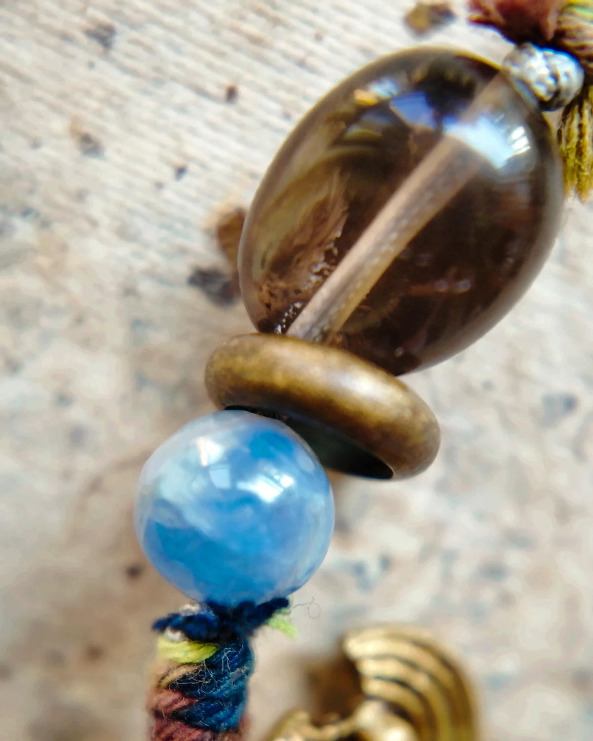 The Duet #48: Kyanite bead, smaller smoky quartz bead and wrapped cotton cord detail