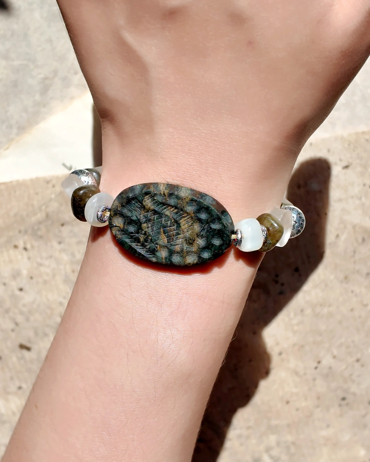 The Earthscript #57: Bracelet worn on wrist in sunlight