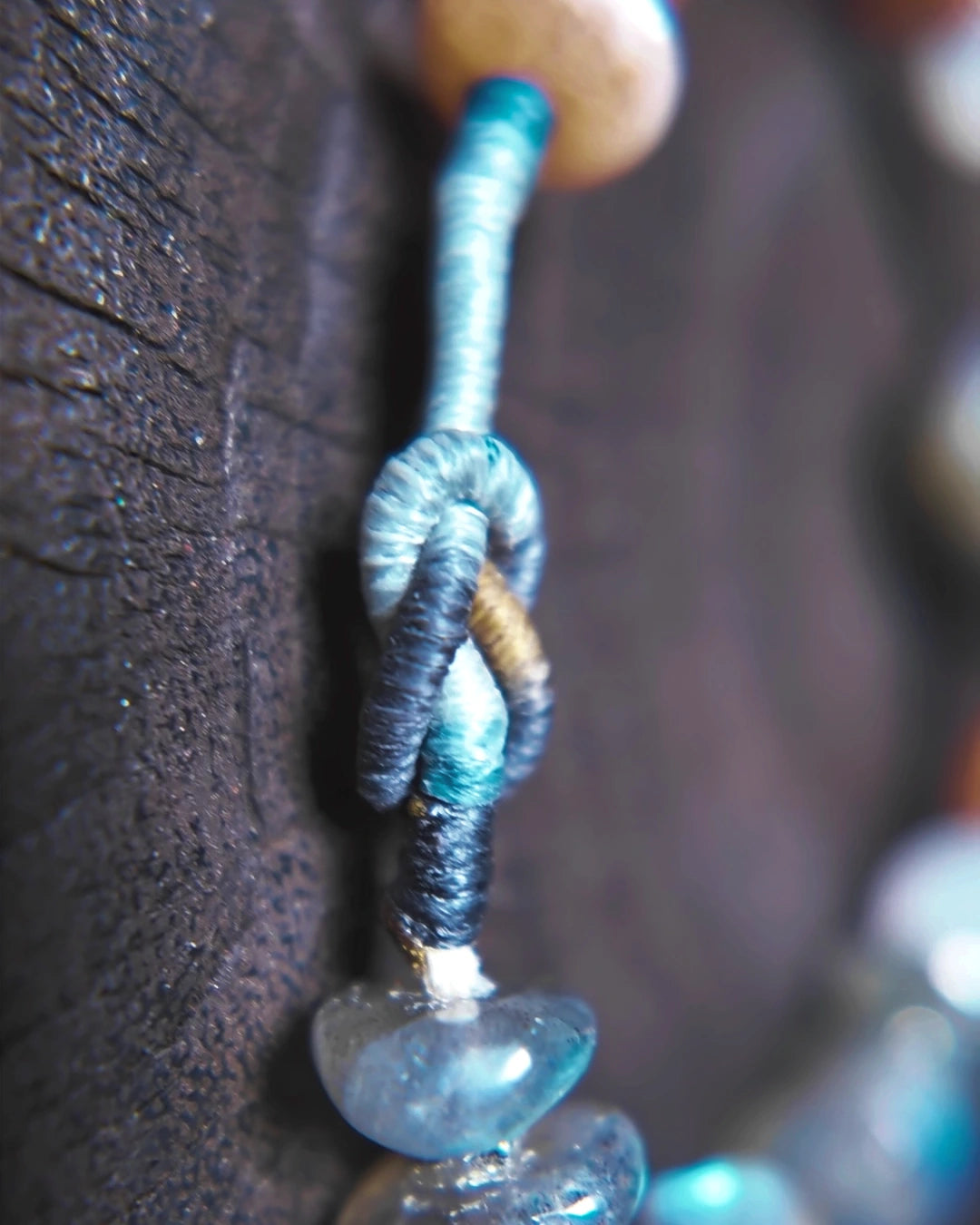 Adjustable waxed-thread braid closure on The Lucent #35 bracelet