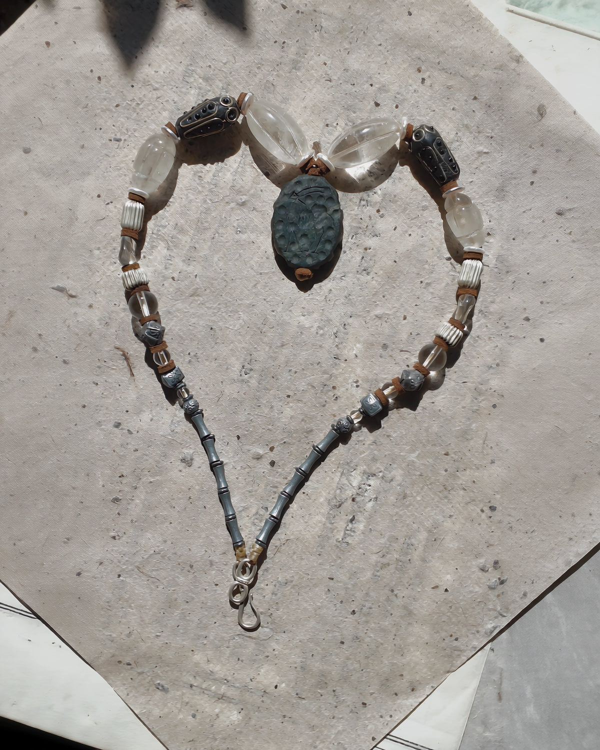 Necklace laid in an oval, showing the full bead arrangement and clasp