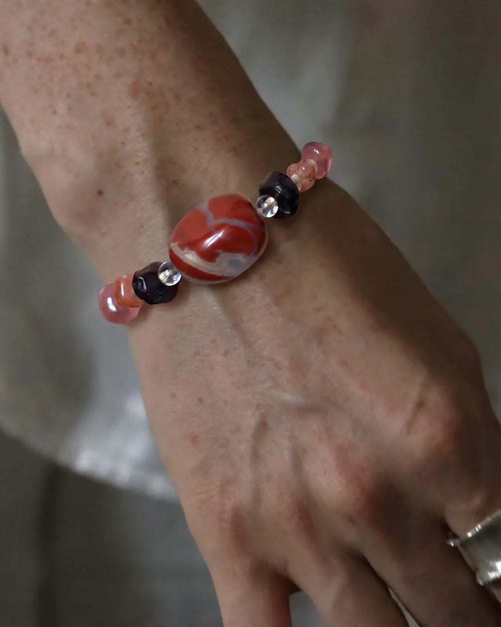 Bracelet #25 with a red focal and mixed accent beads.