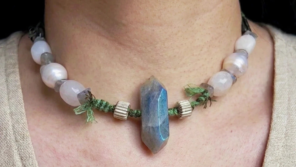 #36 worn at the neck with a polished Labradorite focal, Baroque Pearls, pale trade-name White Moonstone beads, green cord, and a fixed choker fit