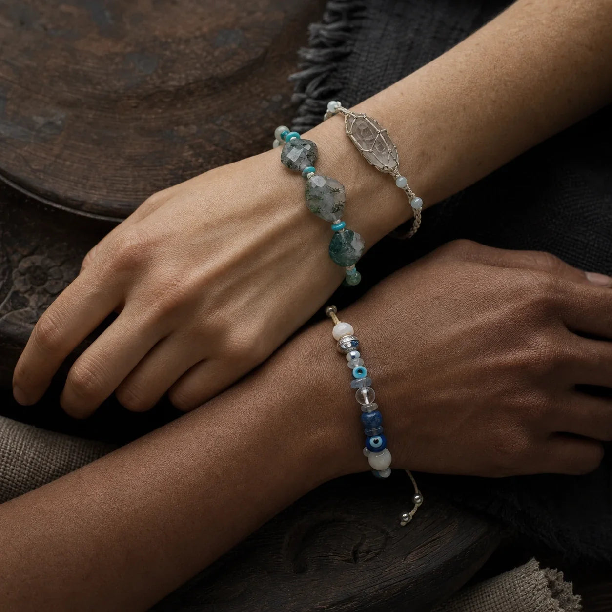 Three people with different skin tones wearing hand-knotted gemstone bracelets by à la luck