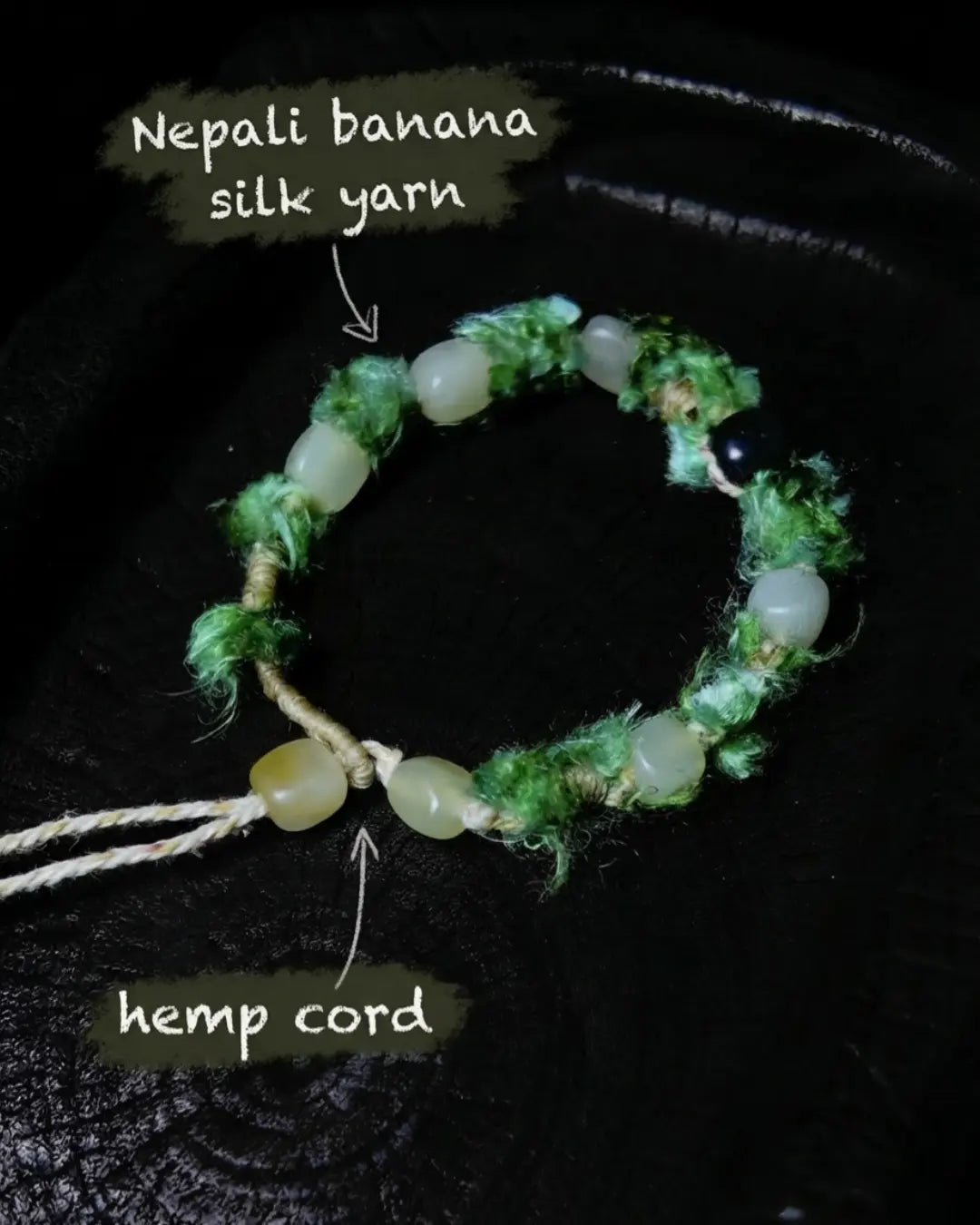 Material detail for The Oasis #13 — labelled Nepali banana silk yarn wrapping and hemp cord adjustment strand of the hand-knotted hetian jade bracelet.