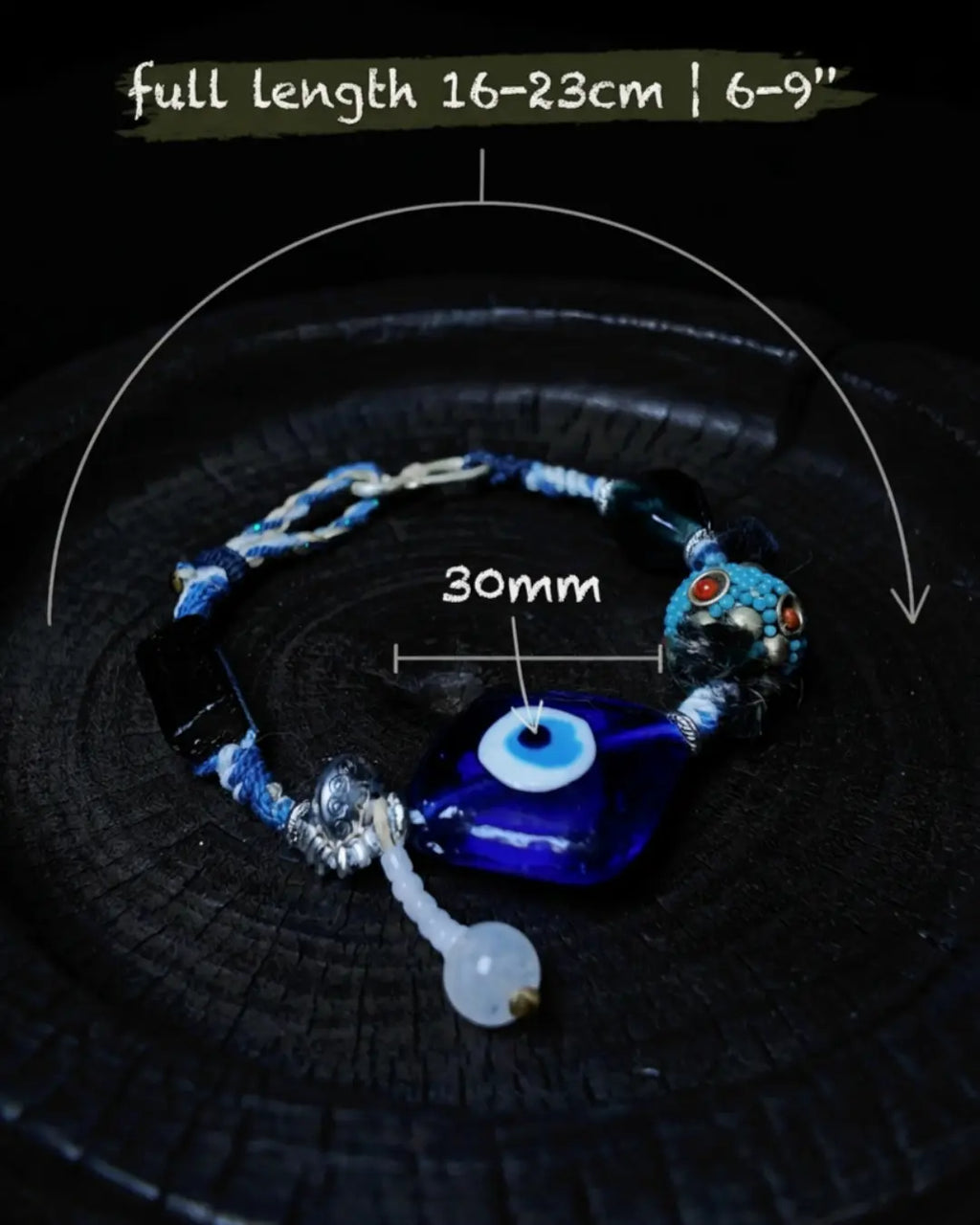 Sizing reference for The Sentinel #15 — 16–23 cm / 6–9 inch full-length adjustable wrist range and 30 mm evil eye focal, flat-lay measurement