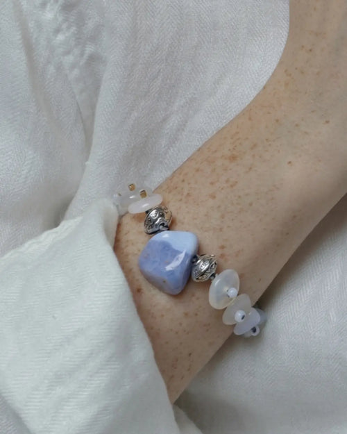 The Oracle #17 blue lace agate and moonstone bracelet by à la luck — worn on the wrist showing the triangular blue lace agate focal stone