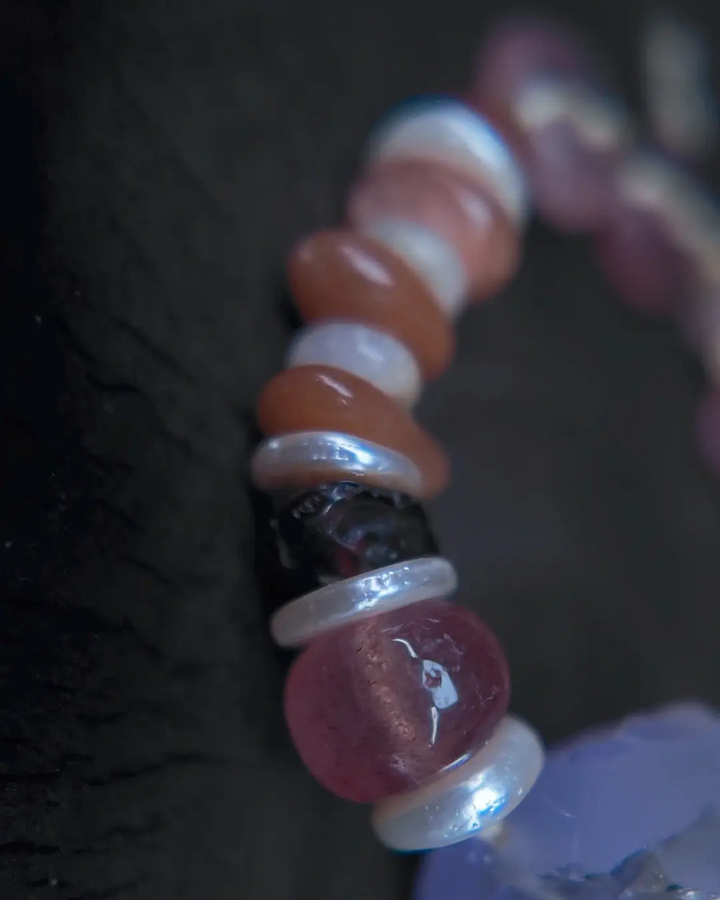 Strawberry quartz and sunstone accent stones close-up detail with mother-of-pearl spacers