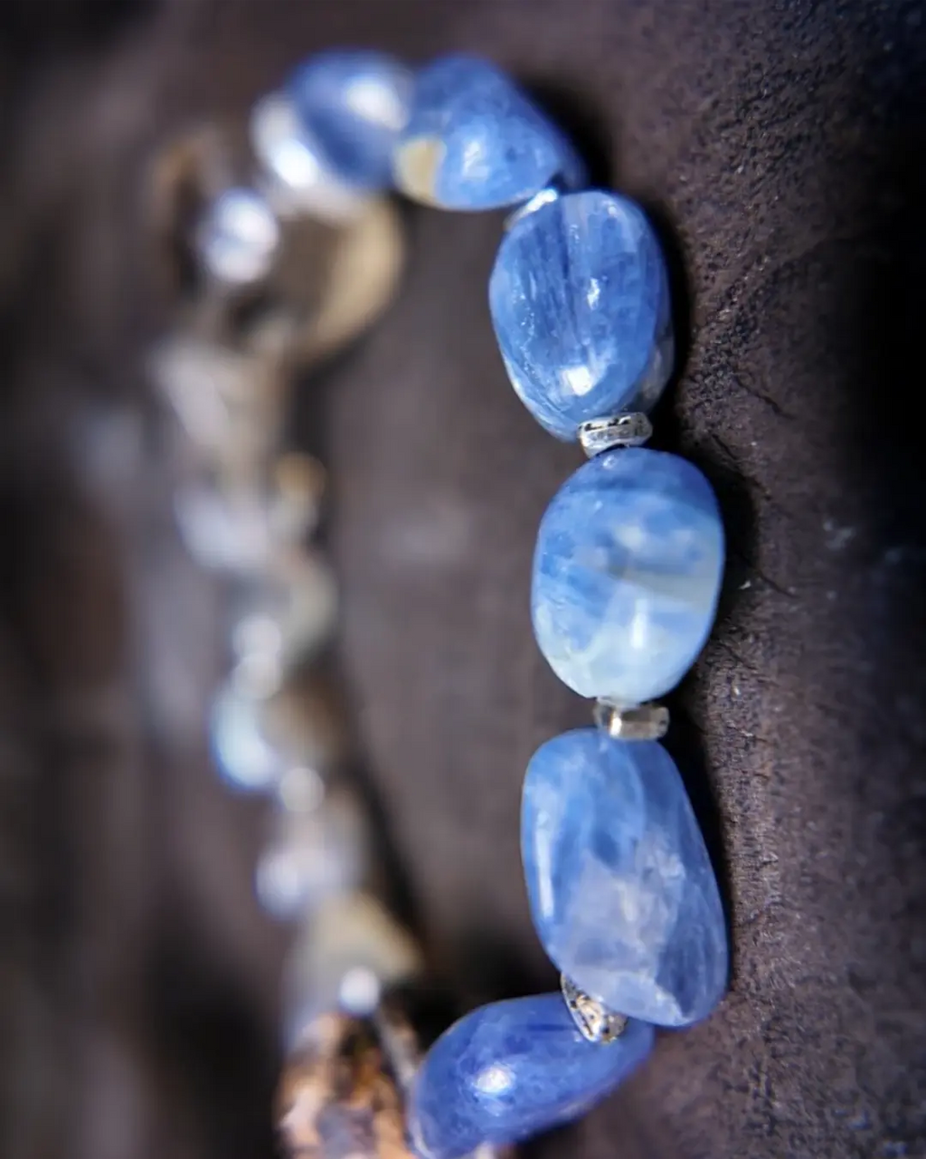 The Witness #24 bracelet detail view showing smoky quartz focal alongside labradorite and kyanite stack