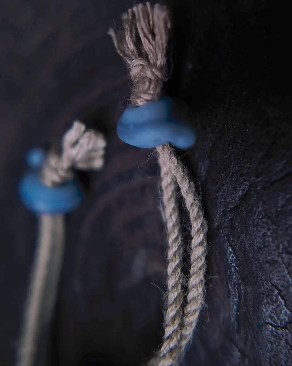Bracelet construction detail with cord and waxed thread sliding-knot closure, paired with Nepali vintage glass bead