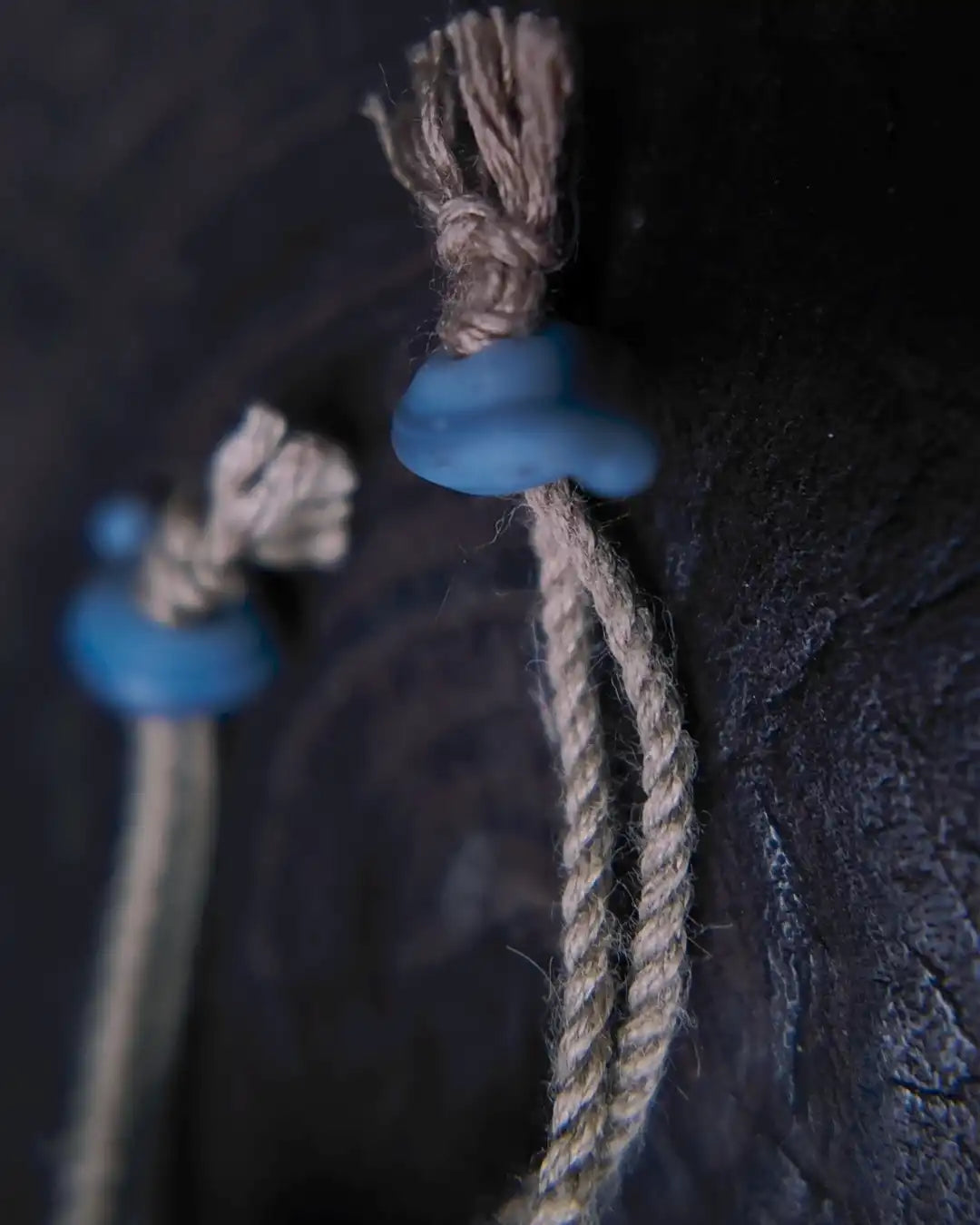 Bracelet construction detail with cord and waxed thread sliding-knot closure, paired with Nepali vintage glass bead