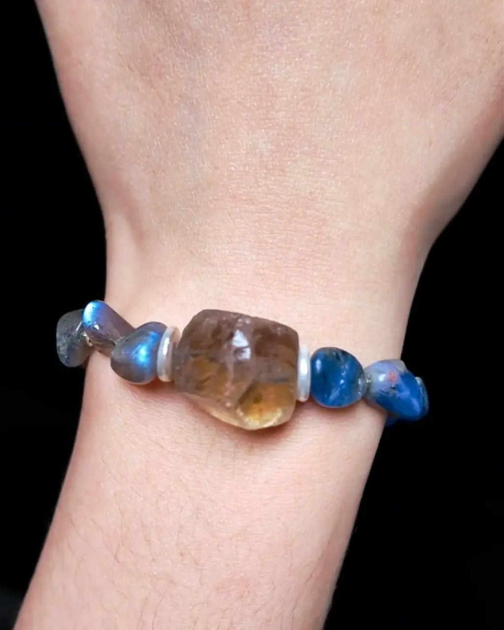Smoky quartz raw focal stone side-profile detail showing translucent natural form and internal mineral inclusions