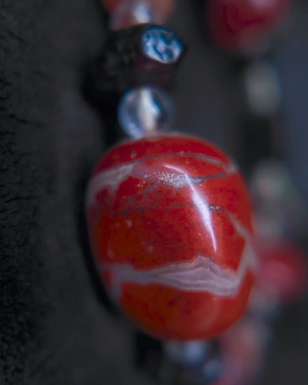 Macro detail of african red jasper, approx 20mm focal stone — close-up view showing natural form and texture