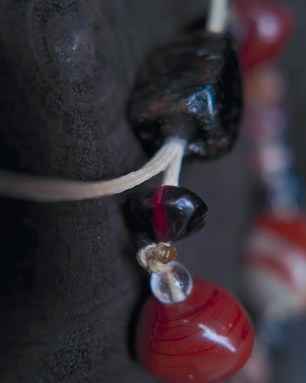 The Hearth #25 bracelet, end-detail view showing toggle closure and cord finish