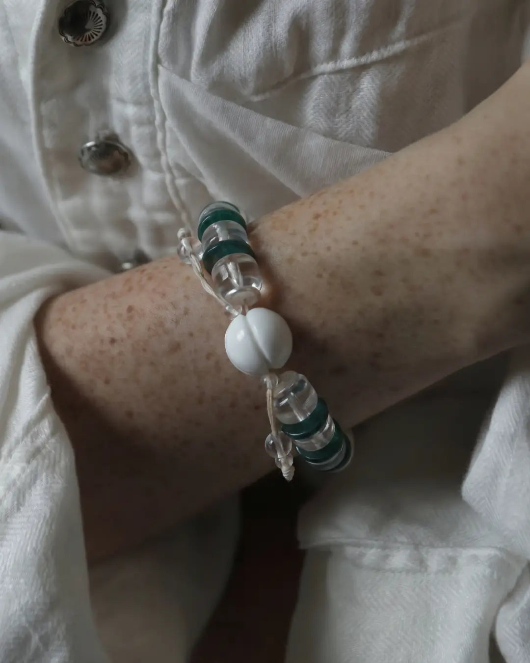 The Vow #26 Himalayan sacred conch and yellow amber wrist mala worn on the wrist