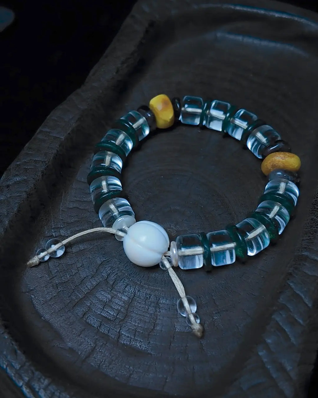 The Vow #26 bracelet, end-detail view showing toggle closure and cord finish