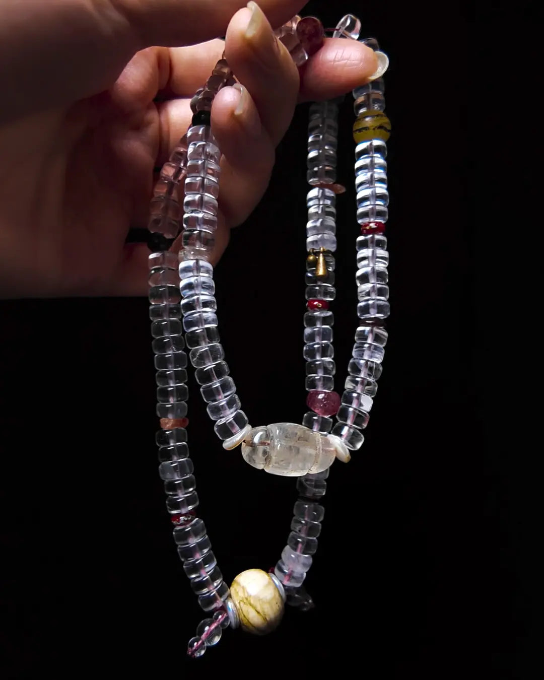 The Adept #27 necklace, hero lifestyle shot featuring himalayan estate clear quartz, approx 24mm