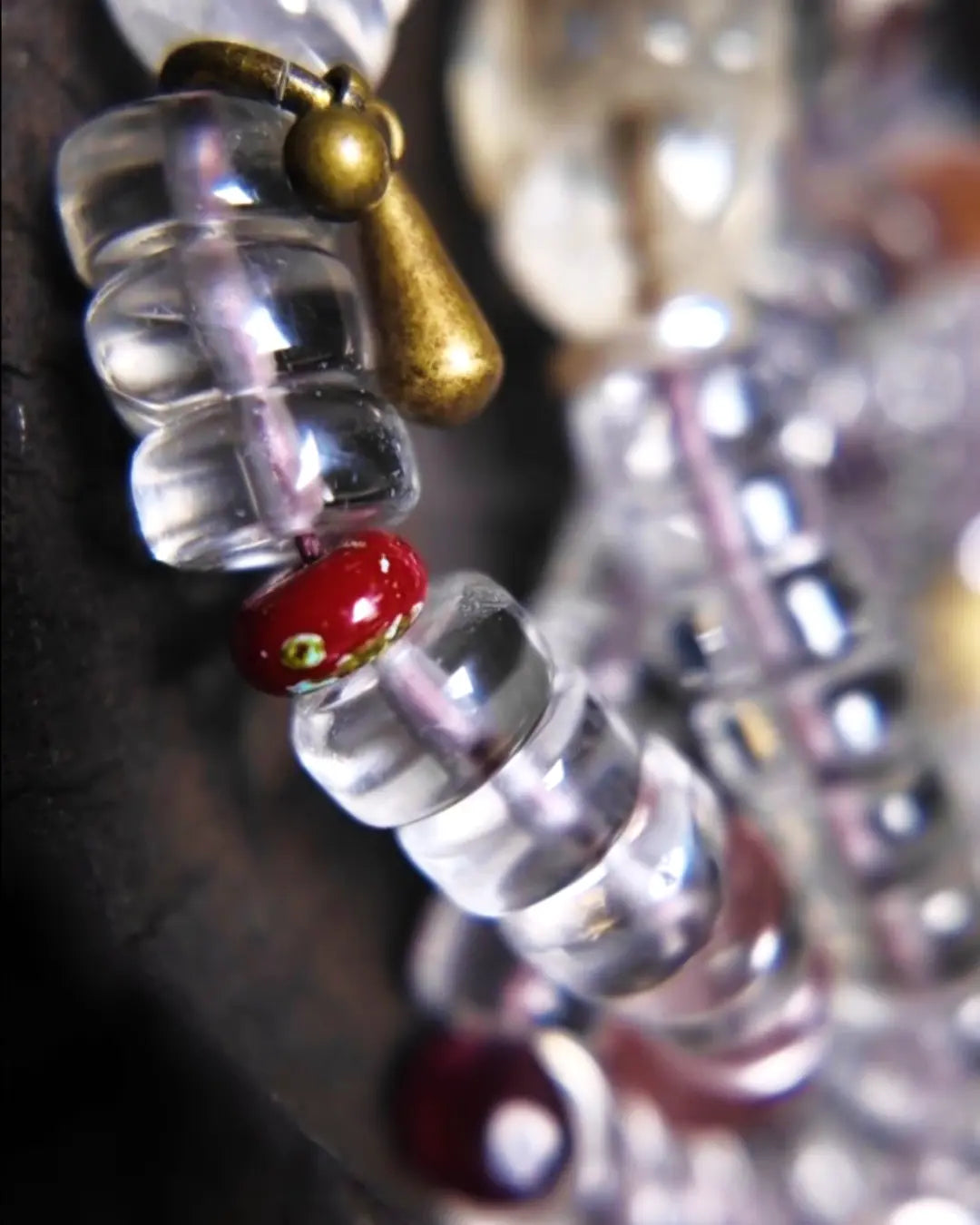 The Adept #27 necklace, detail view 10 — showing bead-knot construction and accent stones