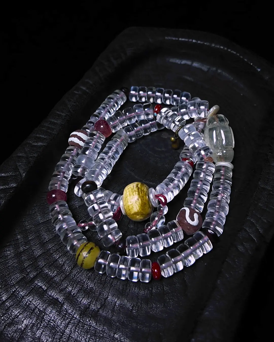 The Adept #27 necklace, end-detail view showing toggle closure and cord finish