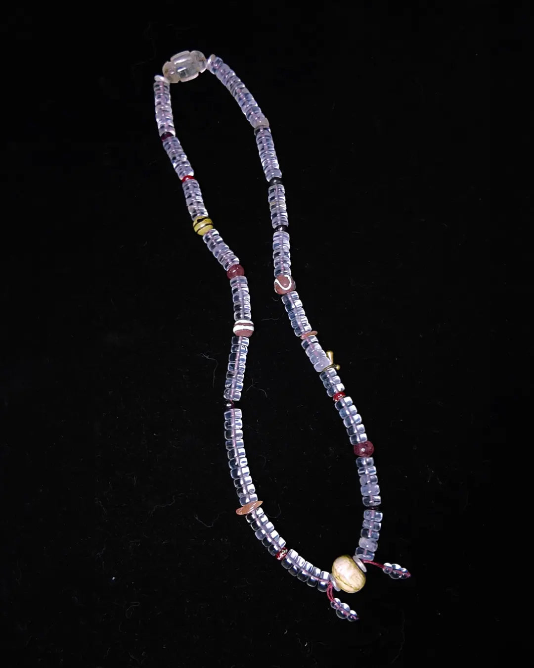The Adept #27 necklace, detail view 4 — showing bead-knot construction and accent stones