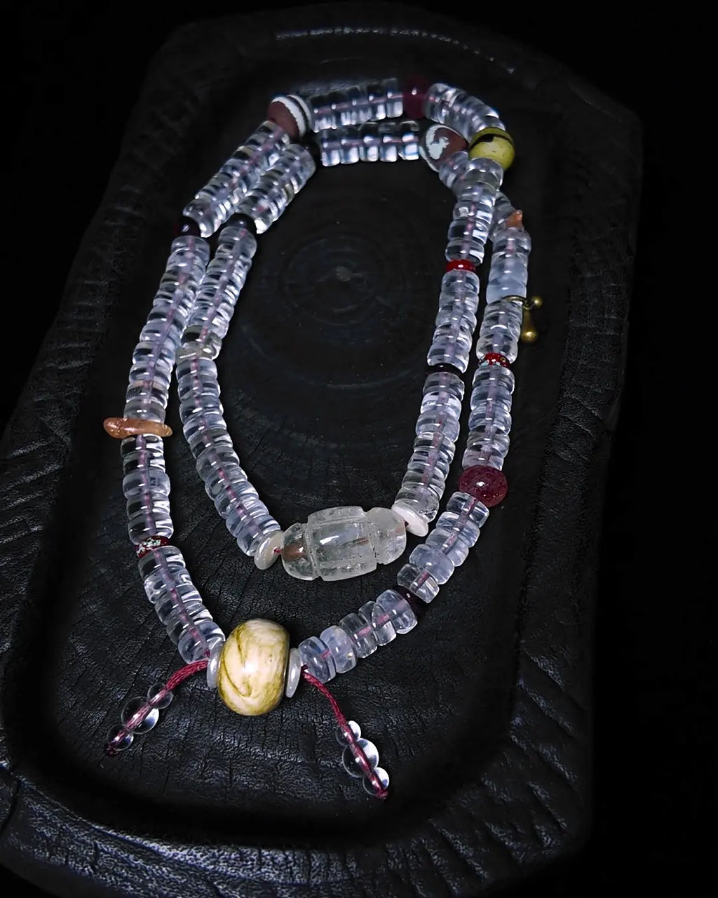 The Adept #27 necklace, detail view 5 — showing bead-knot construction and accent stones