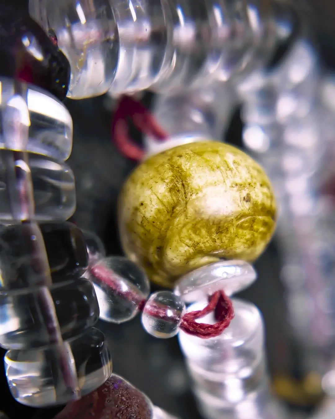 The Adept #27 necklace, detail view 7 — showing bead-knot construction and accent stones