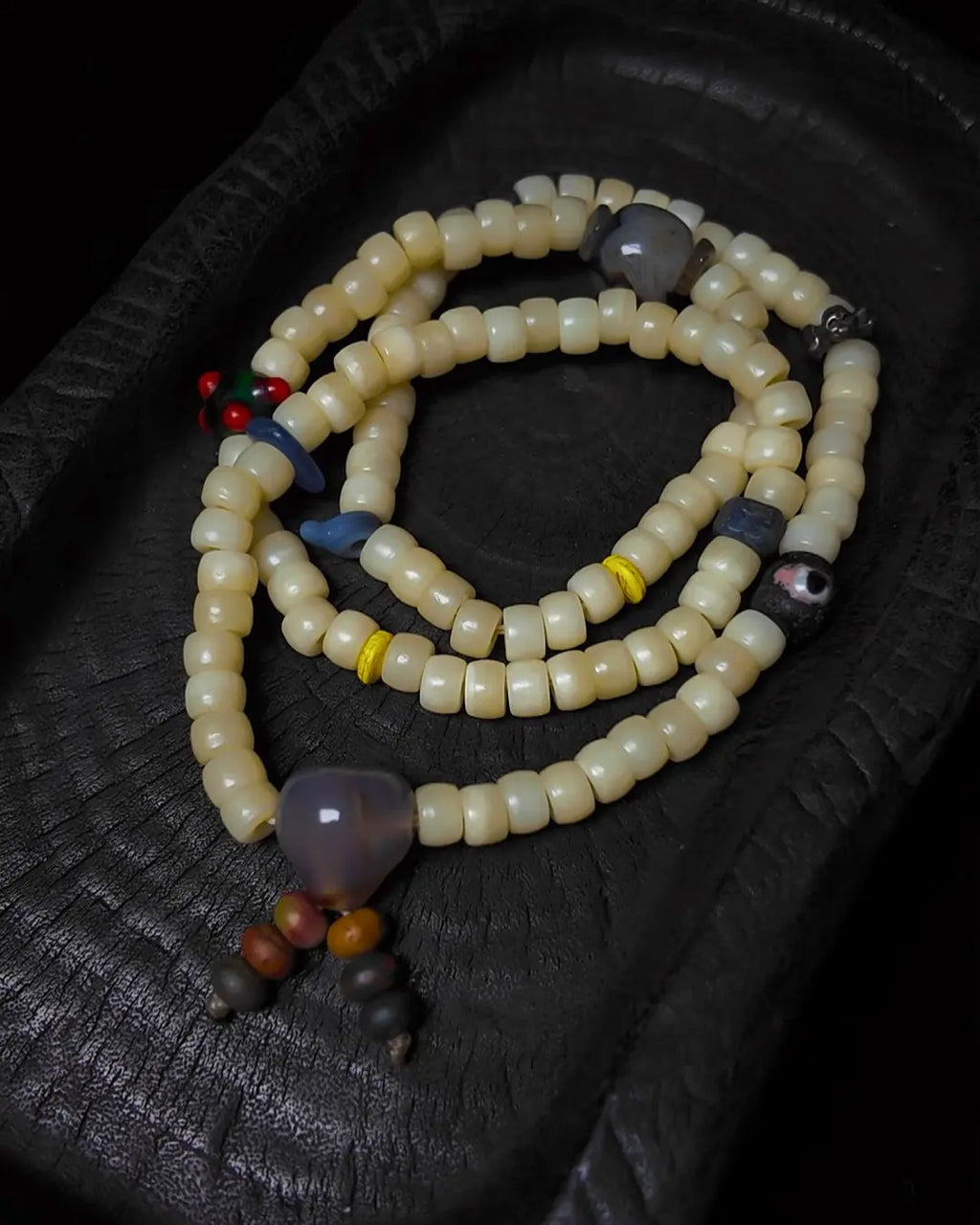 The Veil #28 necklace, detail view 5 — showing bead-knot construction and accent stones