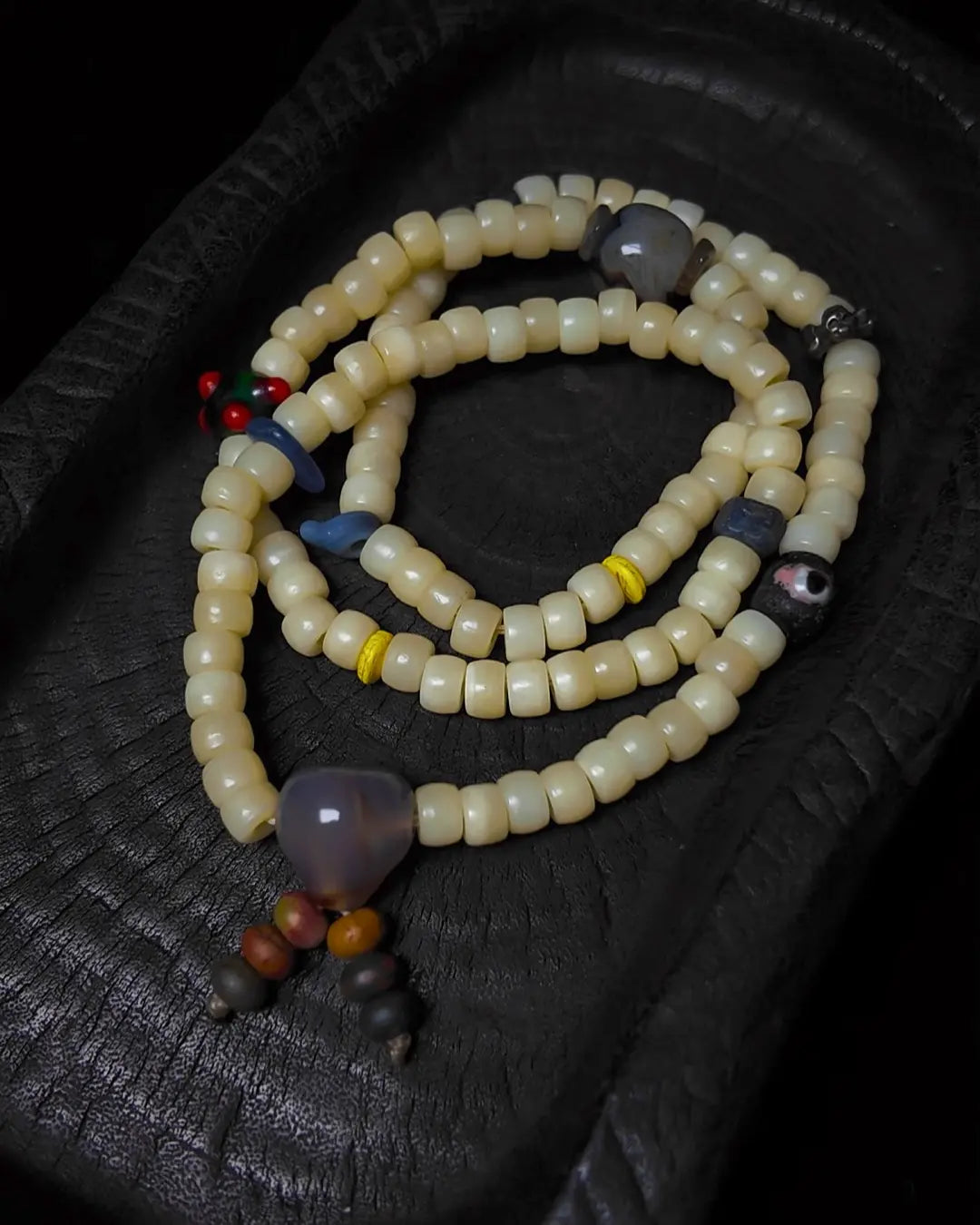 The Veil #28 necklace, detail view 5 — showing bead-knot construction and accent stones