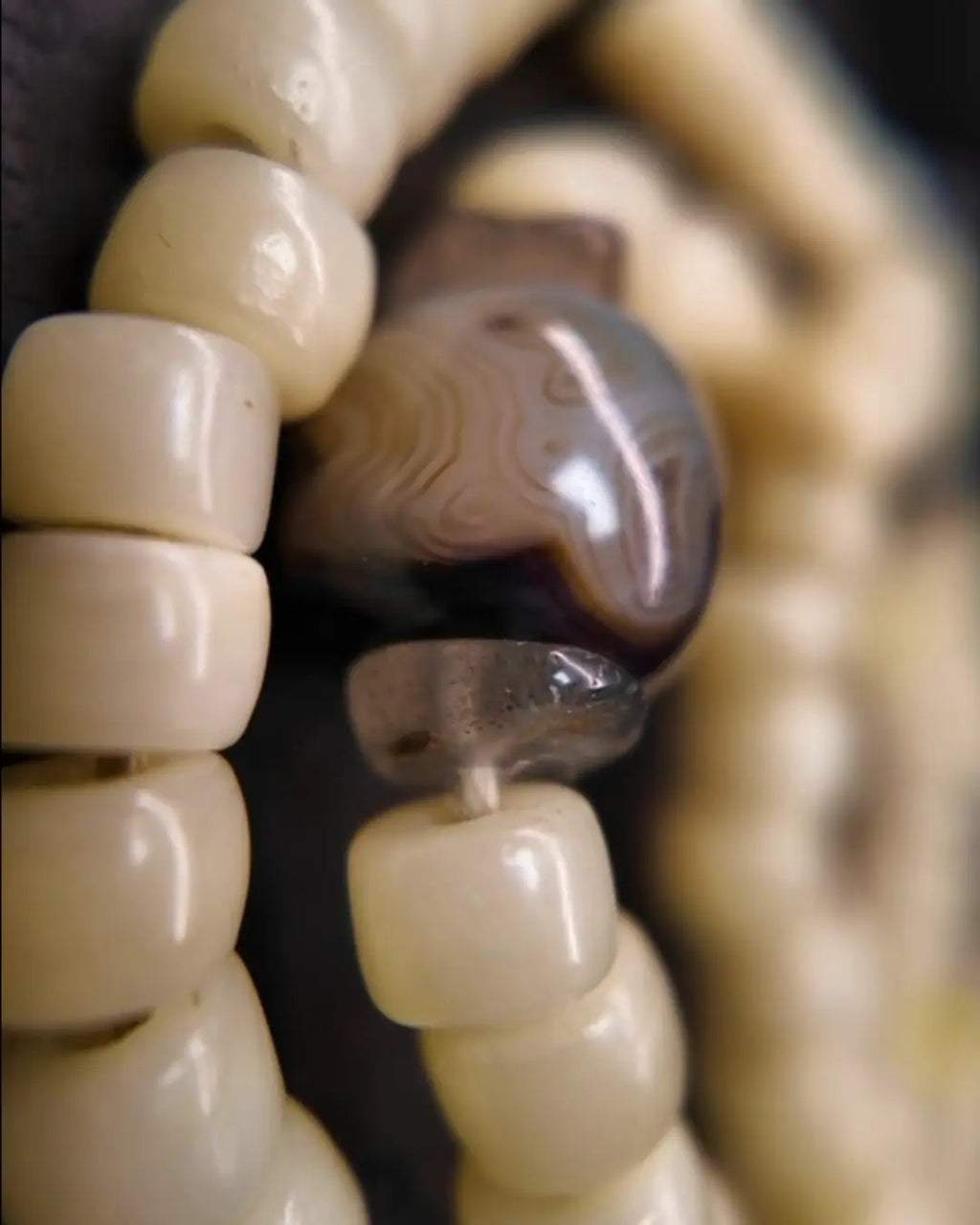 The Veil #28 necklace, detail view 7 — showing bead-knot construction and accent stones