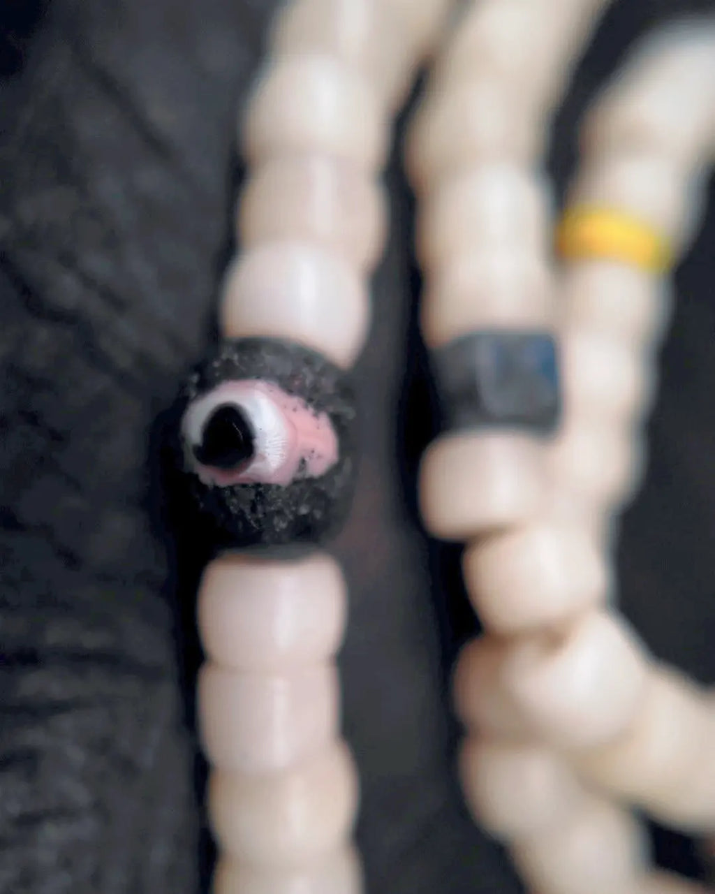 The Veil #28 necklace, detail view 9 — showing bead-knot construction and accent stones