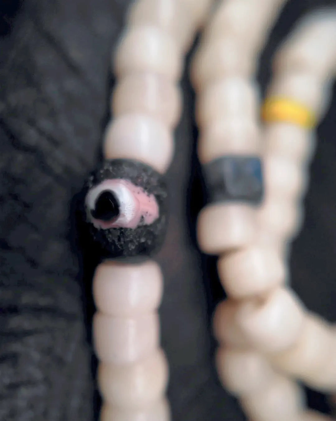 The Veil #28 necklace, detail view 9 — showing bead-knot construction and accent stones
