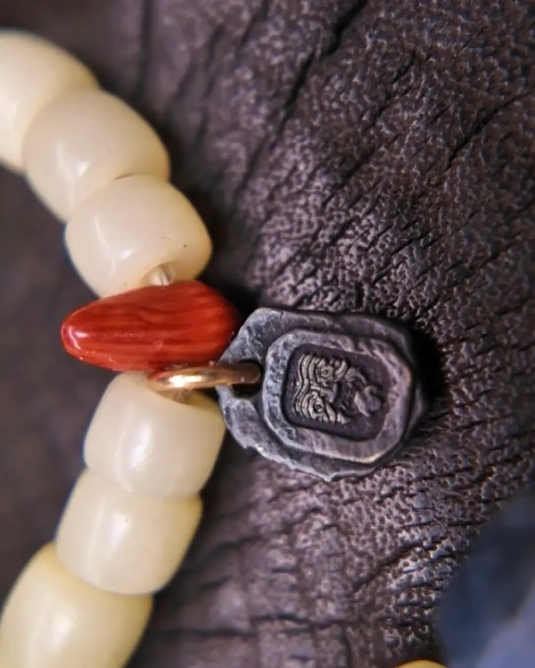 The Spark #29 necklace, detail view 10 — showing bead-knot construction and accent stones