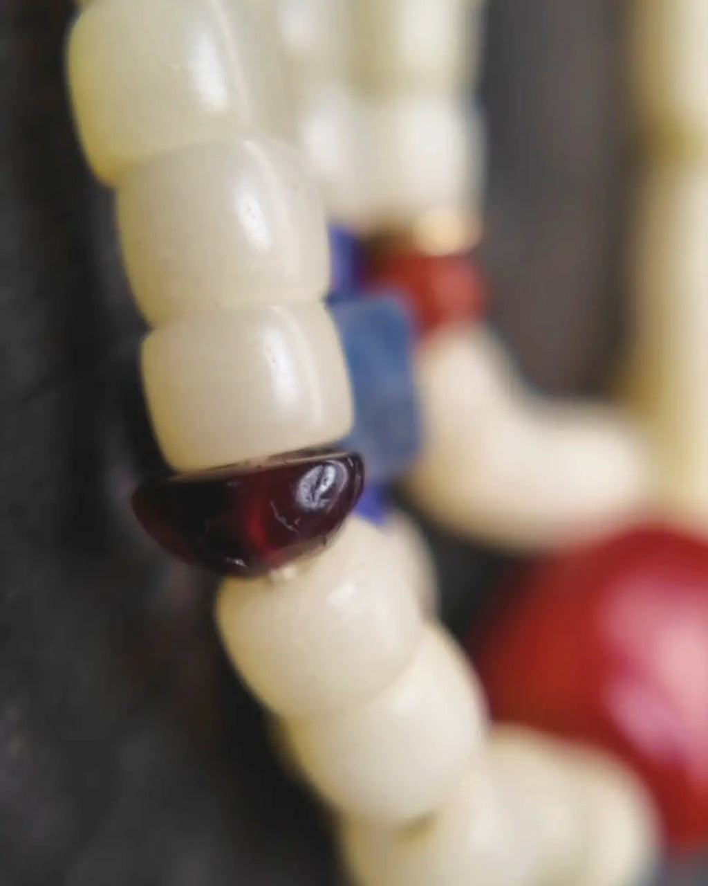 The Spark #29 necklace, detail view 11 — showing bead-knot construction and accent stones