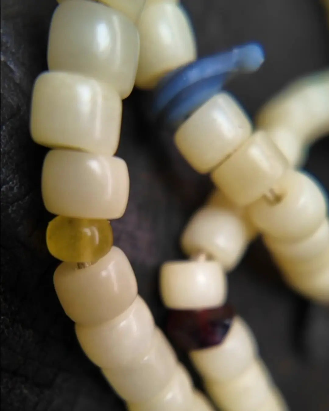 The Spark #29 necklace, detail view 13 — showing bead-knot construction and accent stones