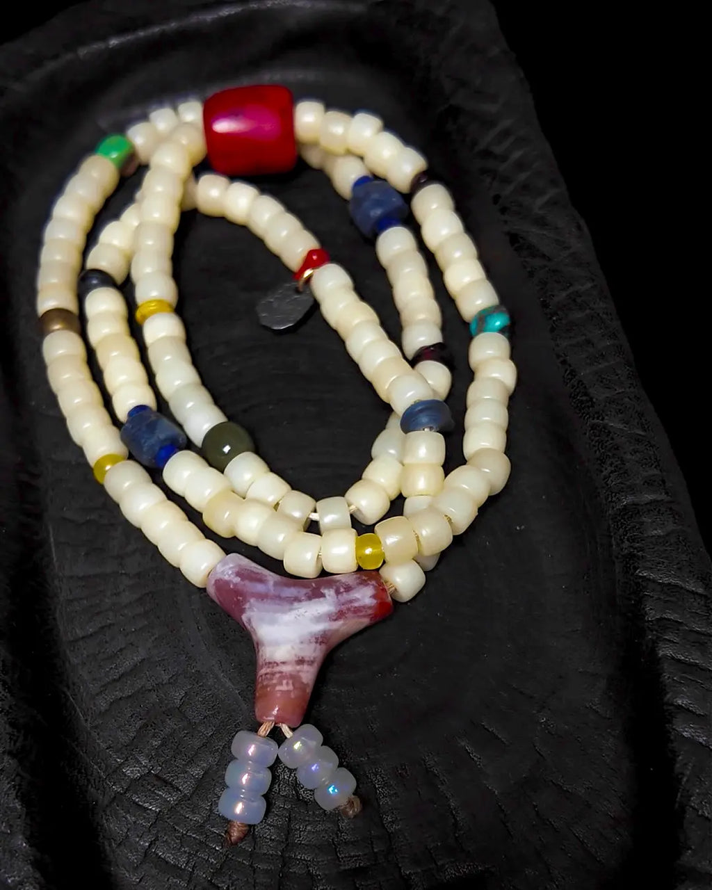 The Spark #29 necklace, end-detail view showing toggle closure and cord finish