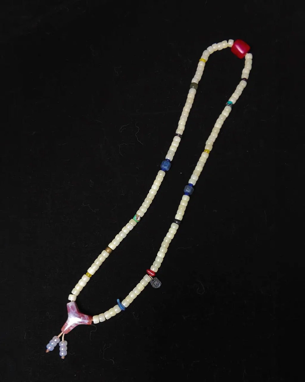 The Spark #29 necklace, detail view 4 — showing bead-knot construction and accent stones