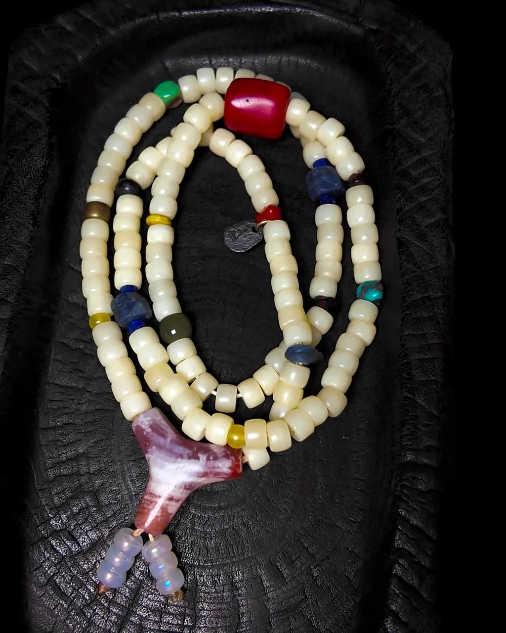 The Spark #29 necklace, detail view 5 — showing bead-knot construction and accent stones
