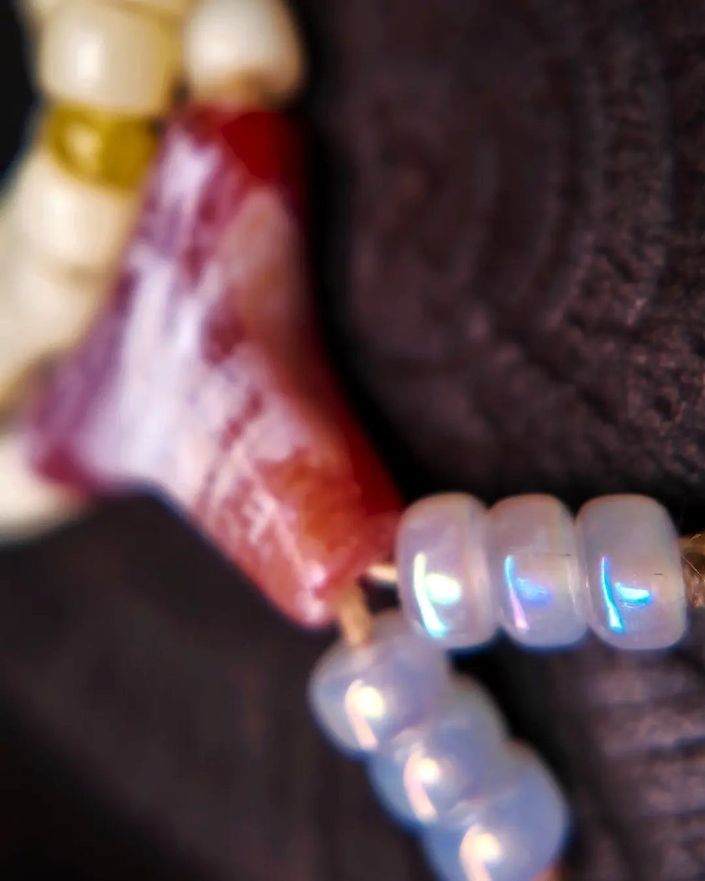The Spark #29 necklace, detail view 7 — showing bead-knot construction and accent stones