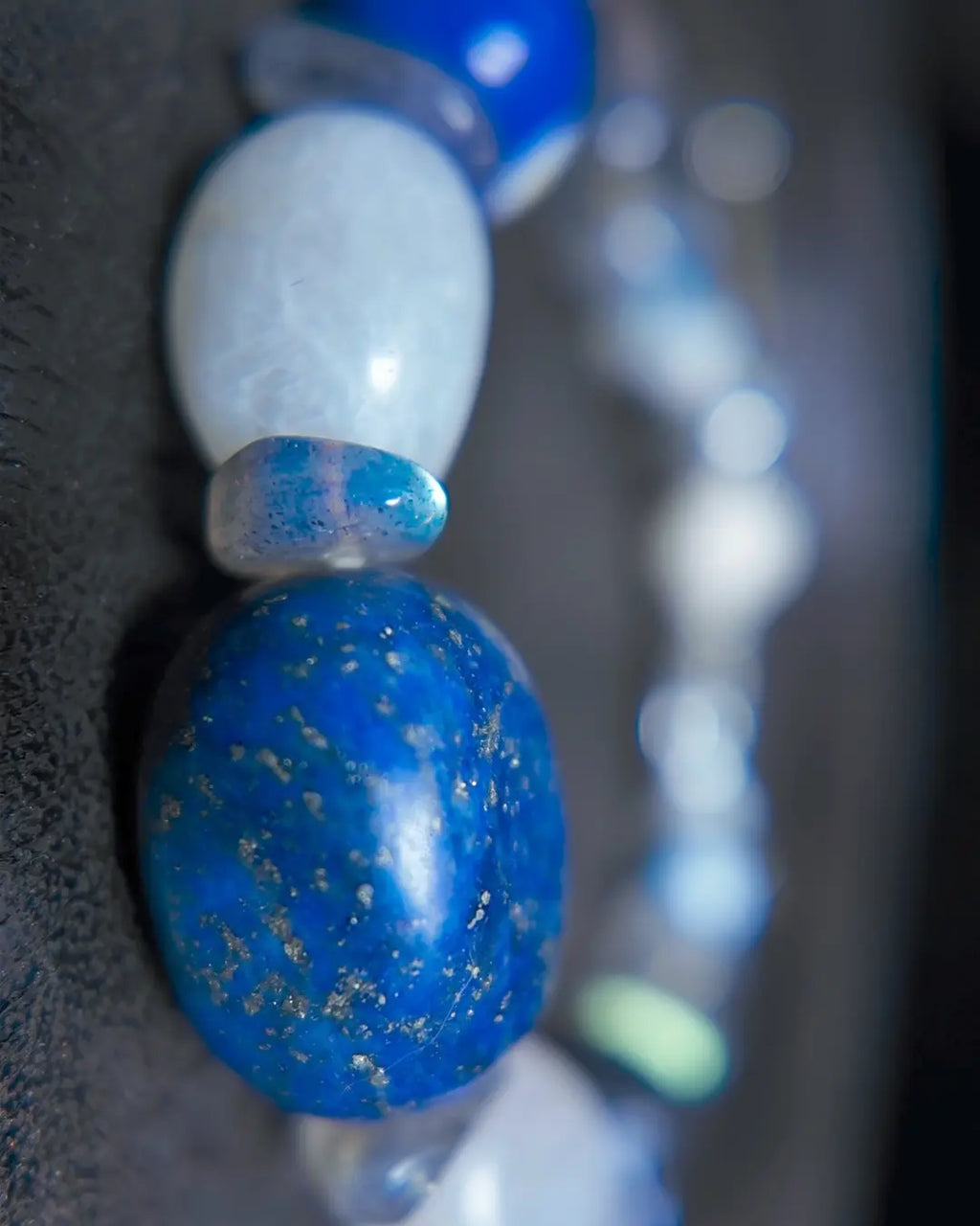 Macro detail of 18mm Afghan lapis lazuli focal nugget and blue moonstone bead