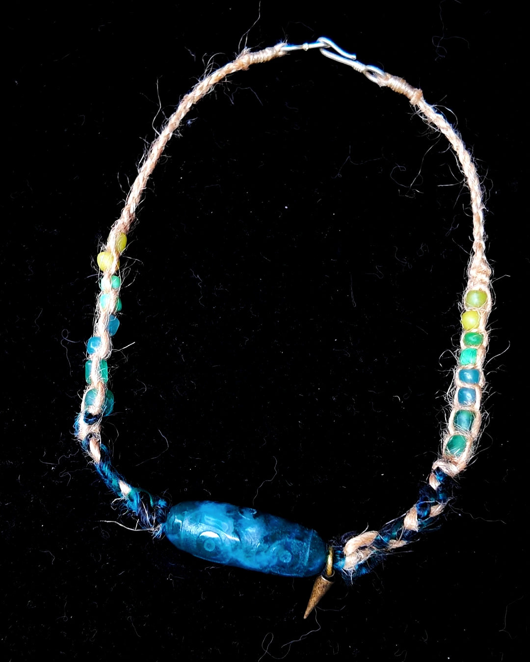 Full view of The Axis #39 moss agate hemp and banana-silk choker on black