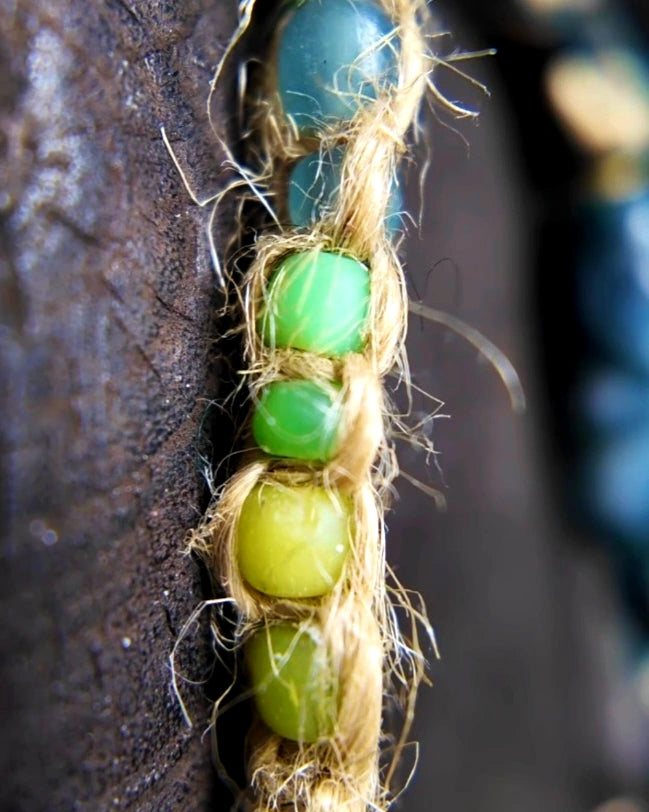 Detail of hemp cord, Nepali banana-silk wrapping and Nepali glass beads