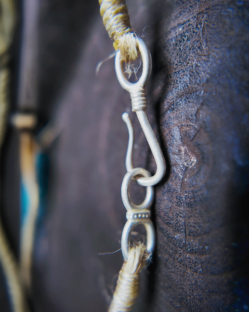 Macro detail of the oxidized copper S-hook plated with 925 silver