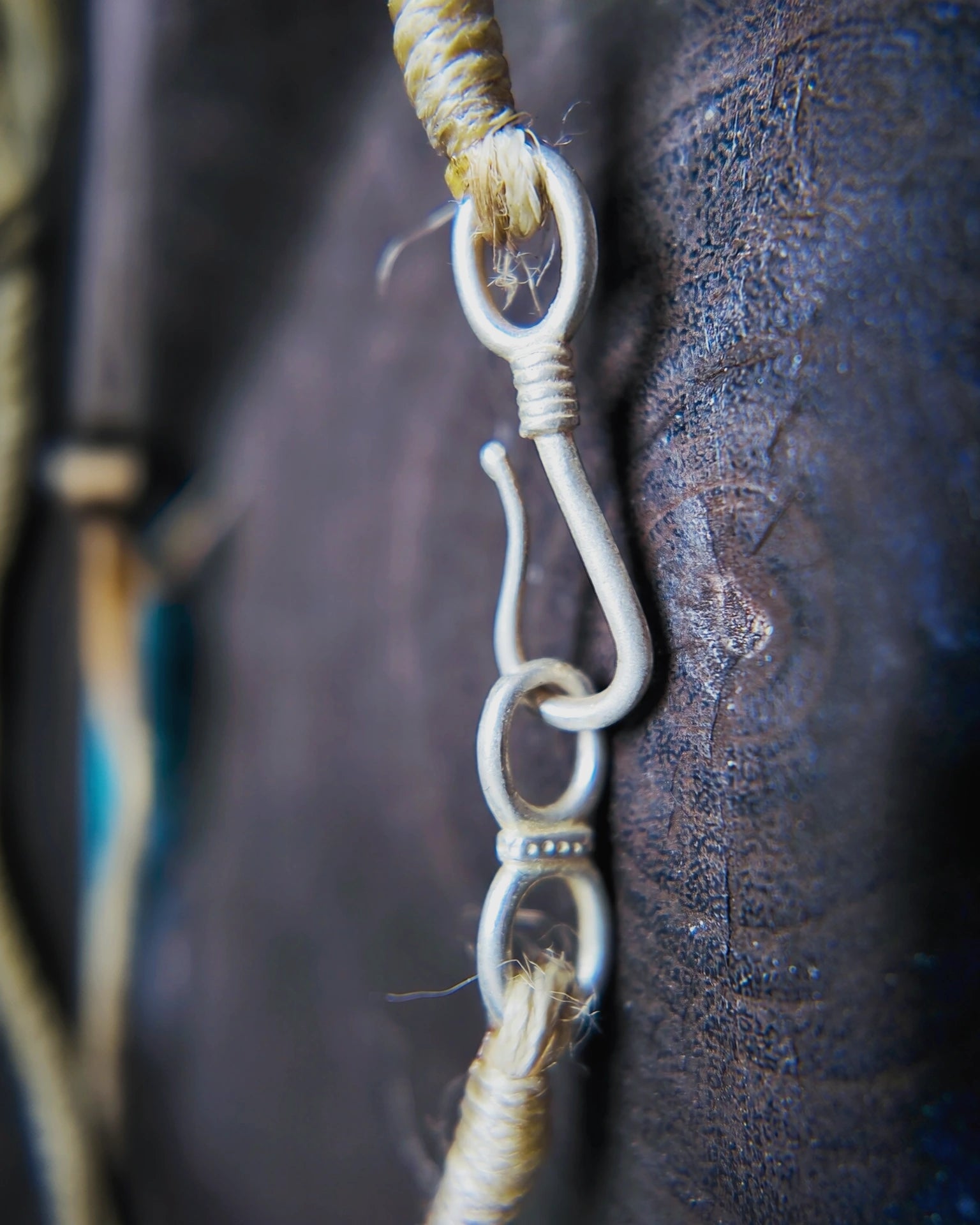 Macro detail of the oxidized copper S-hook plated with 925 silver