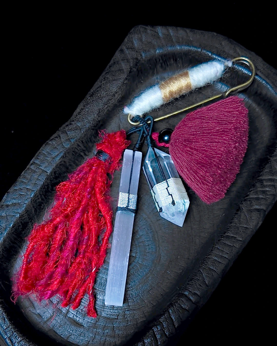 The Beacon #41 shown in full on a dark carved tray with its solid brass pin open
