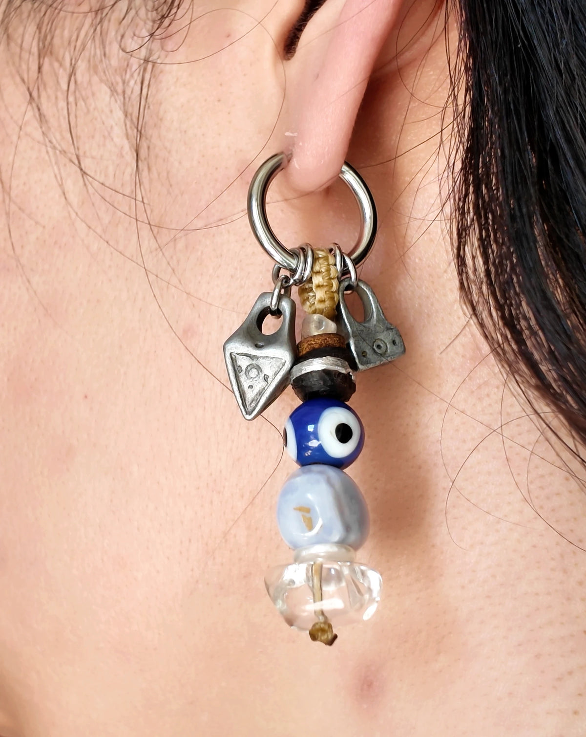 The Bluewatch #56: Complete earring worn, showing the eye bead and pale blue agate