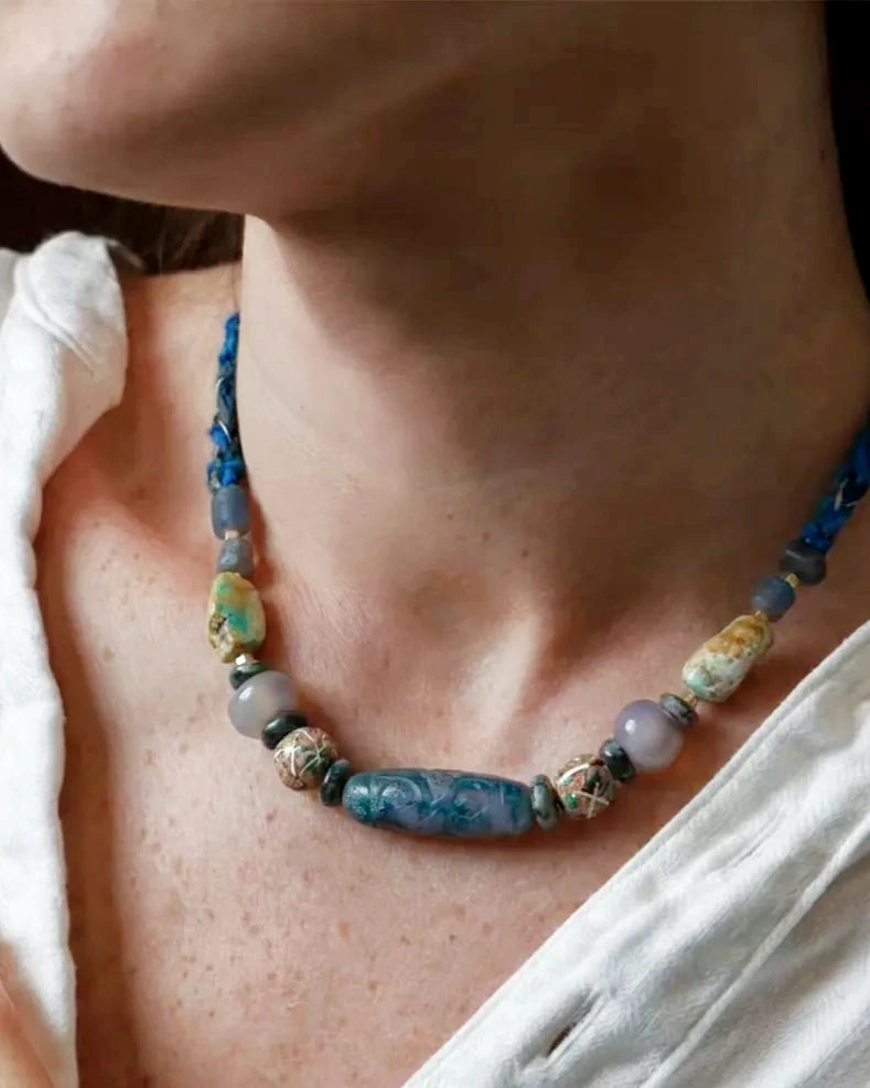 The Confluence #40 moss agate and turquoise necklace worn at the base of the neck for scale