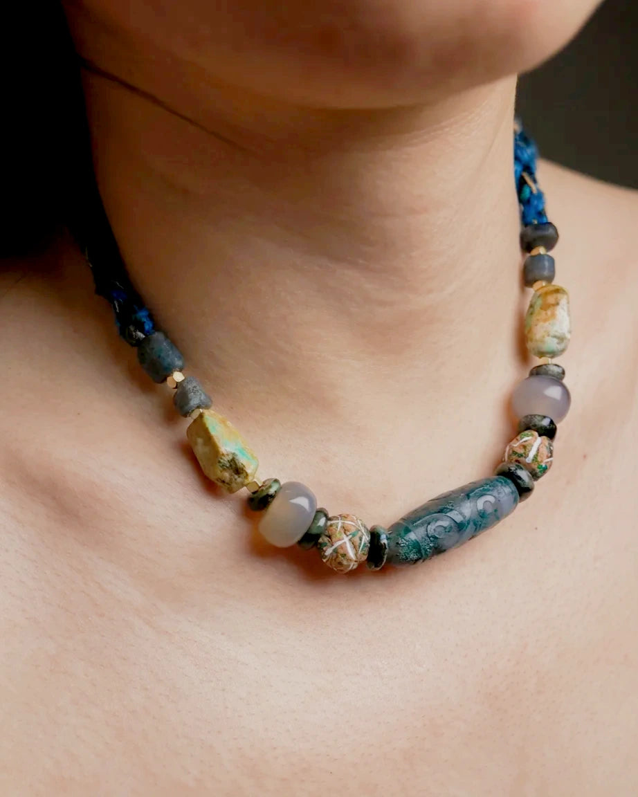 Untreated natural turquoise, grey agate, kambaba jasper and Nepali ceramic beads in profile