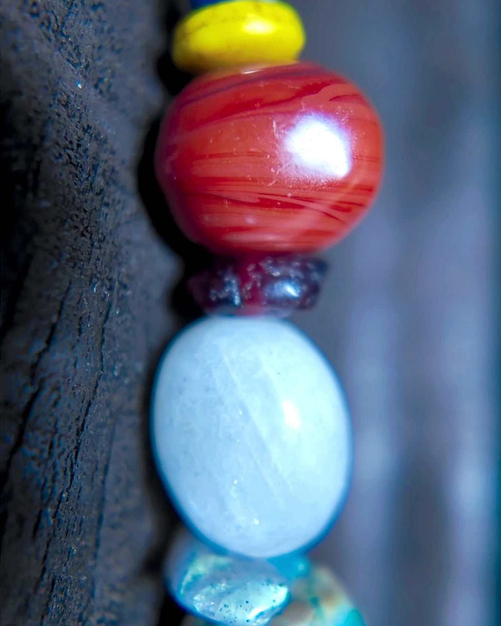Detail of labradorite, moonstone, garnet, Nepali glass and lapis on the long earring