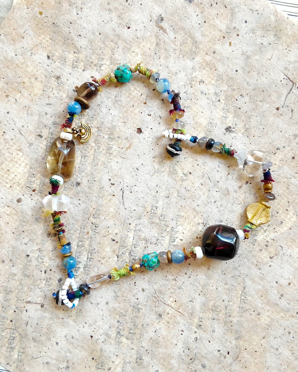 The Duet #48: Both Duet bracelets joined into a single necklace, full flat-lay view