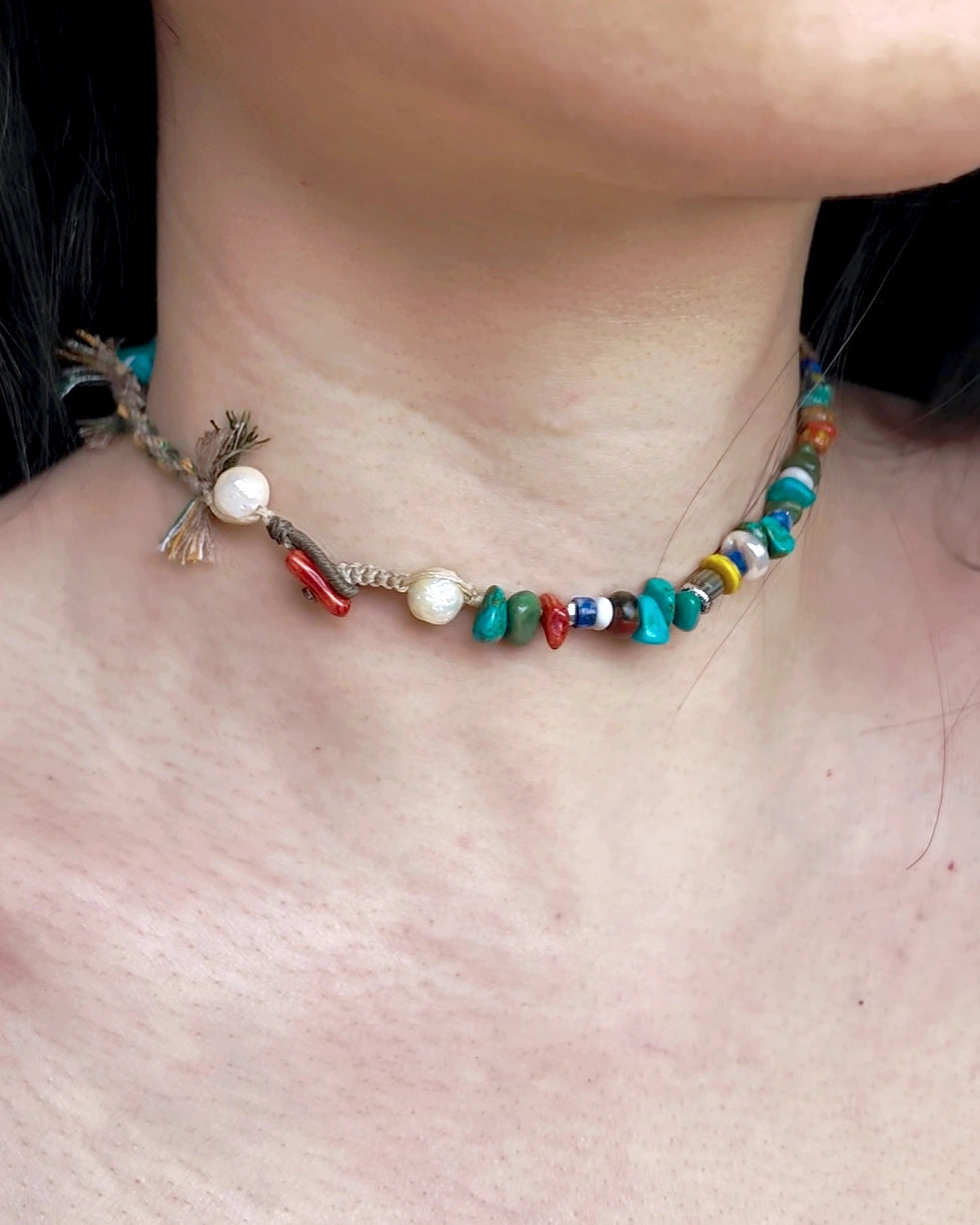 Side view of The Gatherer #37 convertible choker showing the hand-knotted finish